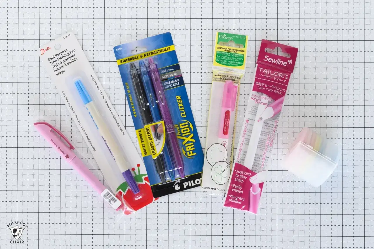 A collection of marking tools for sewing, including erasable pens, chalk pencils, and a disappearing ink marker.