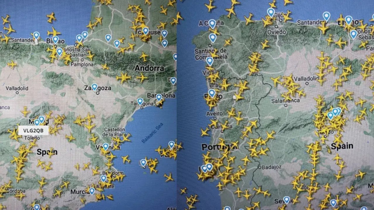 Mapa lotów nad Hiszpanią i Portugalią, z licznymi samolotami na niebie.