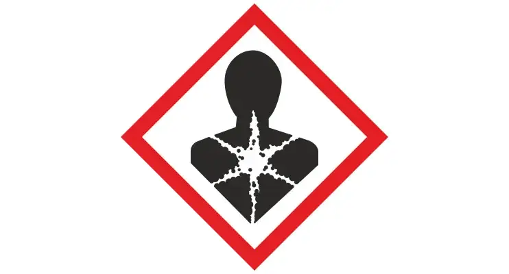 Znak zakazu z symbolem substancji chemicznych lub pigułek, na tle rozmytego laboratorium