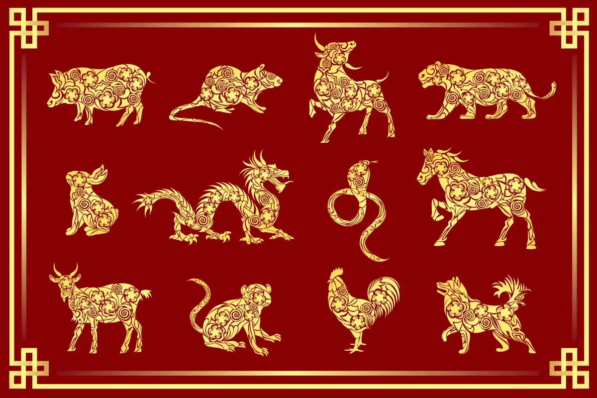 Złote zwierzęta chińskiego zodiaku, symbolizujące horoskop na nowy rok, zdobią czerwone tło.