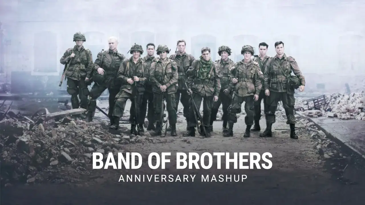 Grupa żołnierzy w mundurach z czasów II wojny światowej, symbolizująca **band of brothers**, stoi na tle zniszczeń.