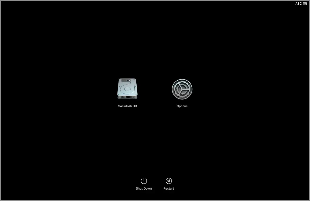 Ekran startowy MacBooka z ikonami Macintosh HD, Opcje, Zamknij i Uruchom ponownie. System operacyjny czeka na wybór.
