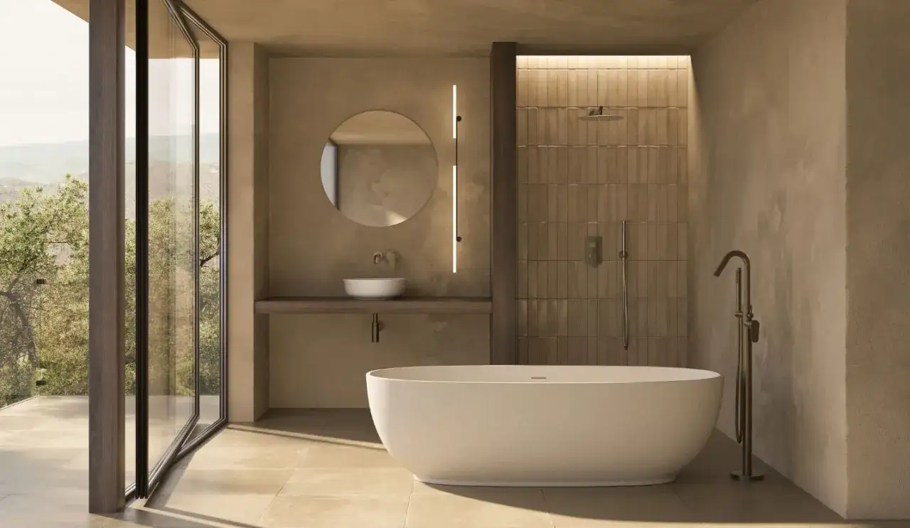 Elegante baño con bañera exenta, lavabo sobre encimera y ducha con paredes de listones verticales. Baños sin azulejos que evocan serenidad.