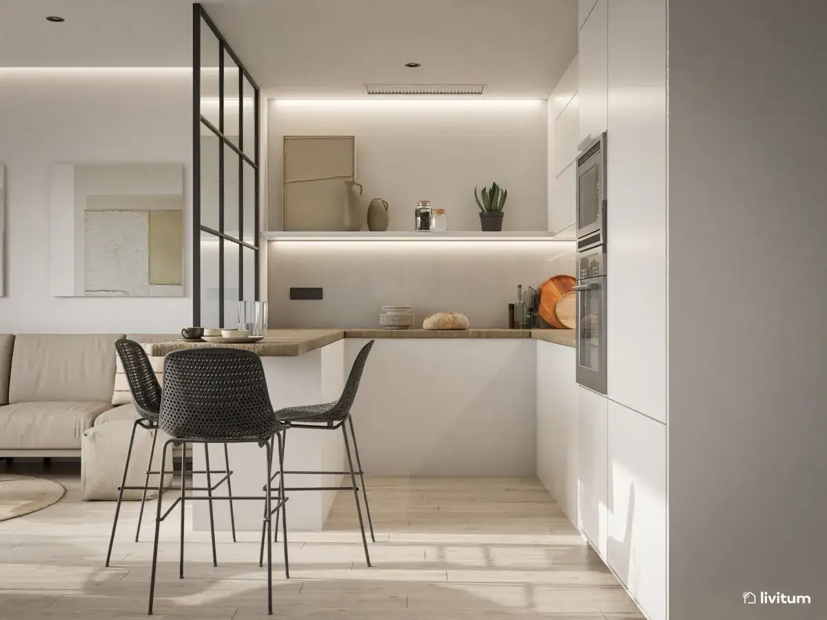 Moderna cocina semiabierta cristal con barra y taburetes. Muebles blancos, encimera de madera y detalles decorativos.