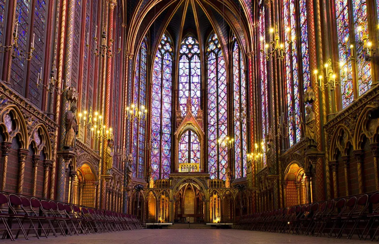 The breathtaking stained glass windows of Sainte-Chapelle in Paris create a dazzling spectacle of light and color, illuminating the ornate Gothic architecture.