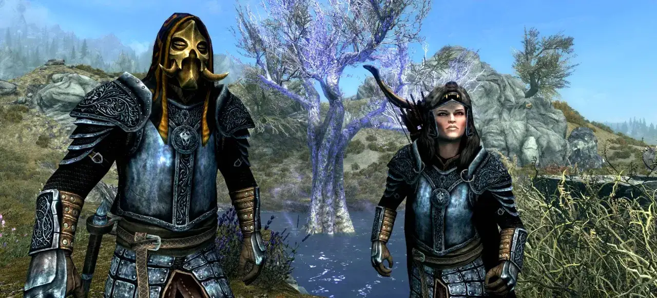 Dwóch wojowników w zbrojach stoi przed magicznym drzewem. Czy Twój sprzęt spełnia **skyrim wymagania**?