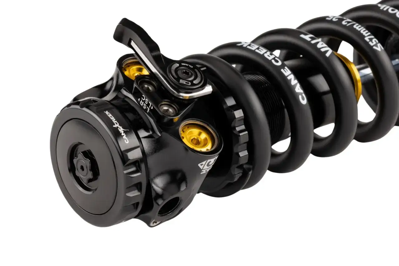 Black Cane Creek coil shock with gold accents. The spring is labeled 