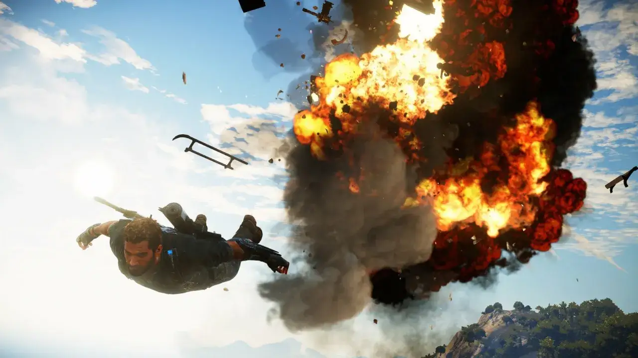 Rico w locie szybowcowym, tuż obok potężnej eksplozji. Akcja z Just Cause 5.