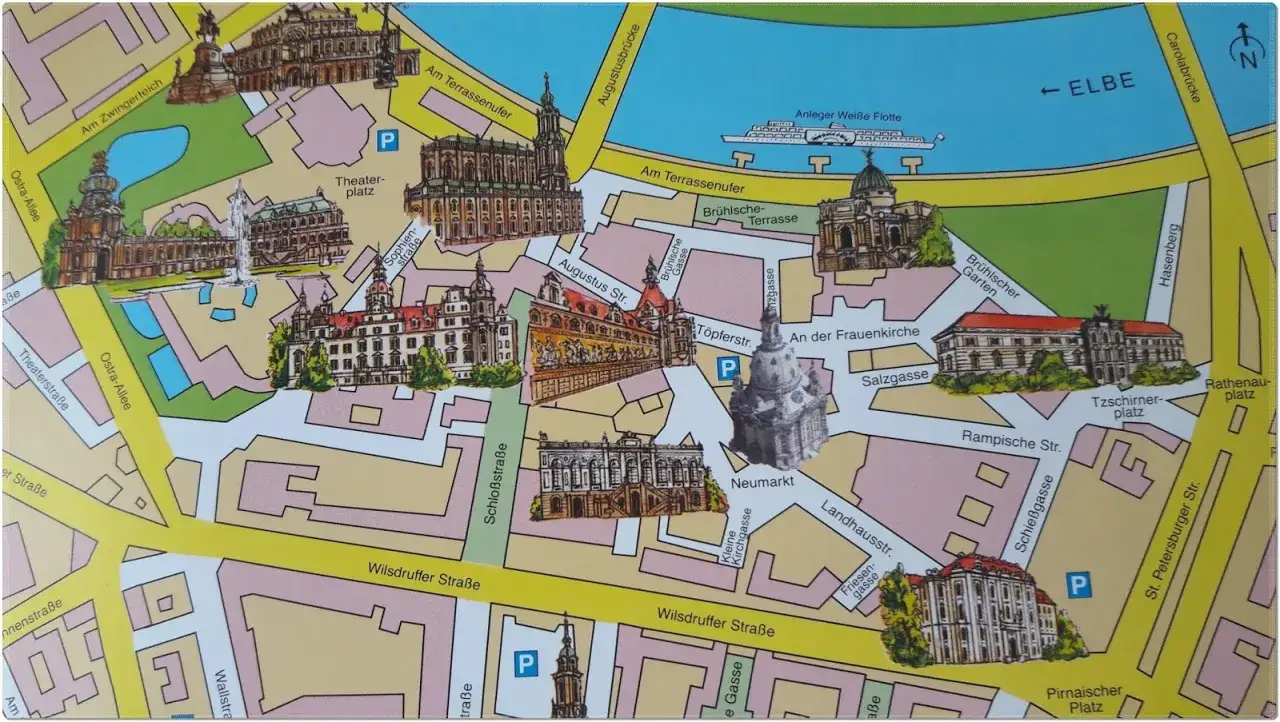 Mapa turystyczna pokazuje, gdzie jest Drezno, z zaznaczonymi zabytkami jak Zwinger i Frauenkirche nad Łabą.