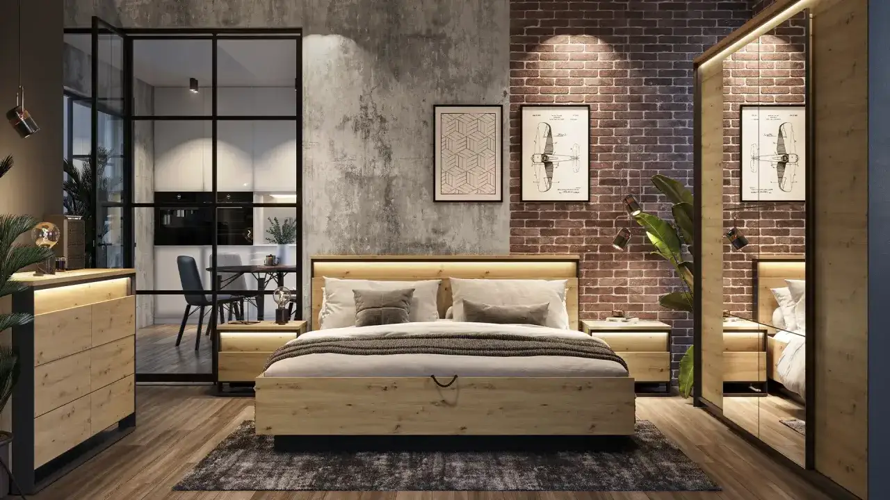 Sypialnia w stylu **soft loft**: drewniane meble, ceglana ściana, beton architektoniczny i przeszklone drzwi do kuchni.