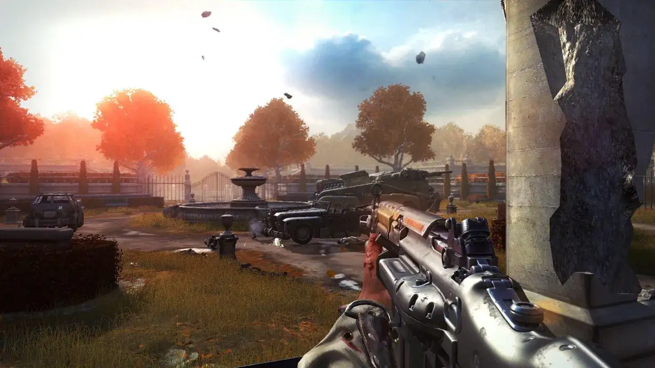 Vista en primera persona de un tiroteo en un jardín con un tanque y un coche, como en una guía de Wolfenstein The New Order.