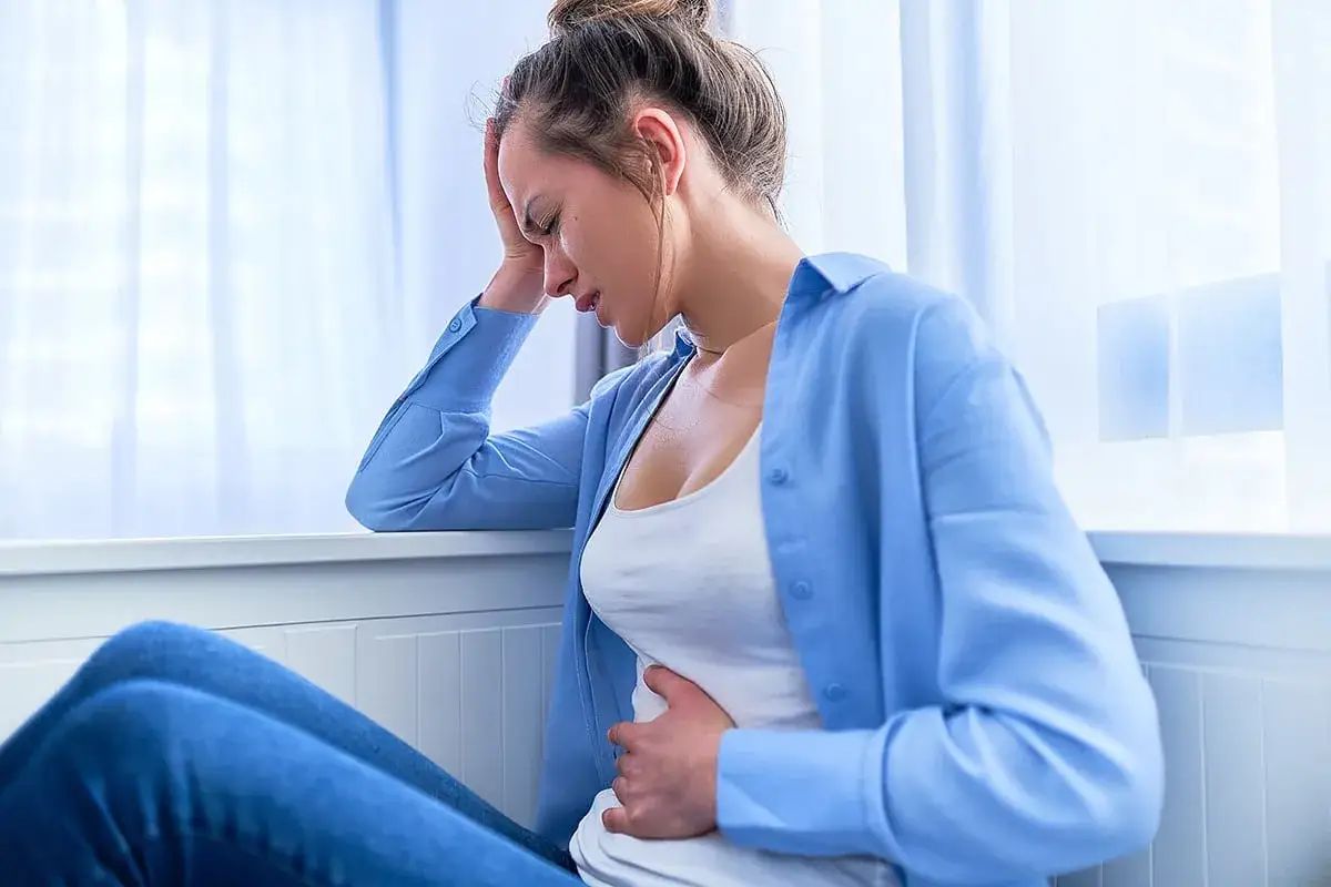 Person feeling nauseous or headache