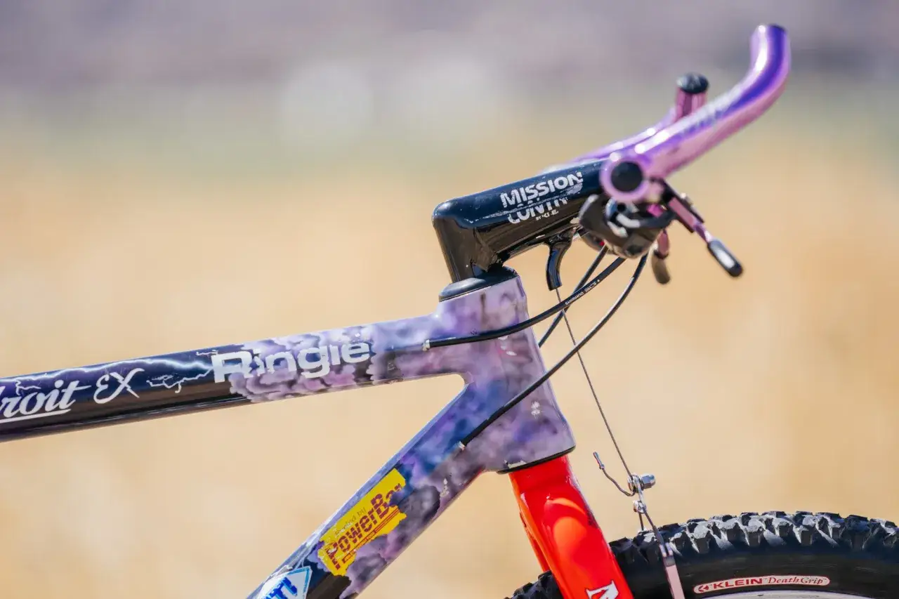 A purple and white marbled Klein adroit bicycle frame with a purple handlebar and black stem.