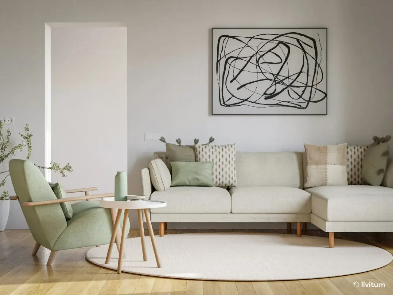 Sofá y sillón en verde menta, combinando con decoración de cojines y jarrón.