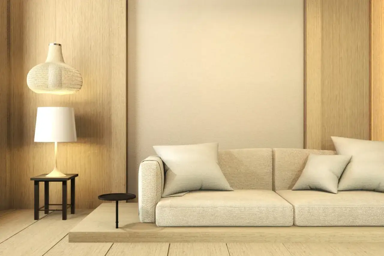 Divani color crema, con cuscini morbidi, in un ambiente moderno con illuminazione soffusa e finiture in legno.