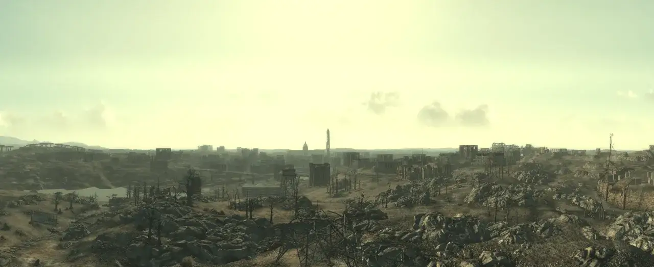 Paisaje desolado de una ciudad en ruinas, con edificios destrozados y vegetación escasa. El cielo es de un tono amarillento, sugiriendo un ambiente post-apocalíptico, como en un **fallout 3 remaster**.