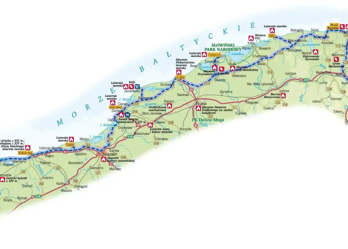 Mapa prezentuje **szlaki turystyczne Polska** wzdłuż wybrzeża Bałtyku, z zaznaczonymi latarniami morskimi, parkami narodowymi i zabytkami.
