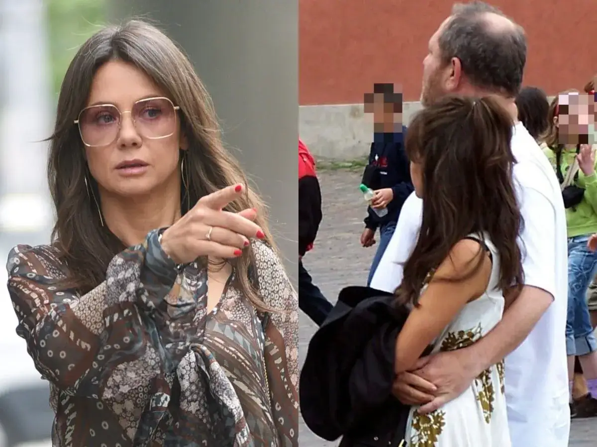 Kobieta w okularach i wzorzystej bluzce, obok mężczyzna obejmujący kobietę. Czy to słynna para, może Rosati Weinstein?