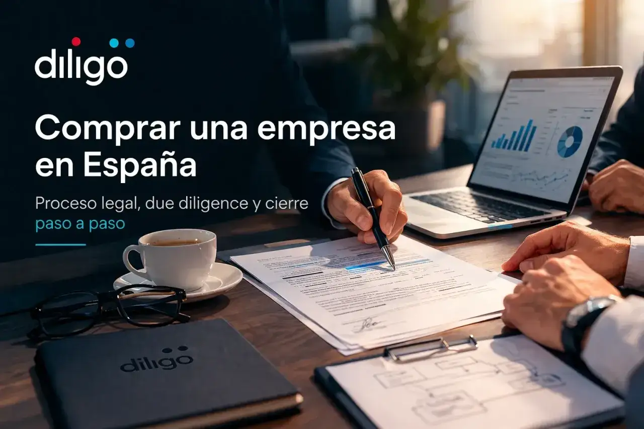 Manos revisando documentos y un port&aacute;til con gr&aacute;ficos, sugiriendo un traspaso de negocio en funcionamiento en Espa&ntilde;a.