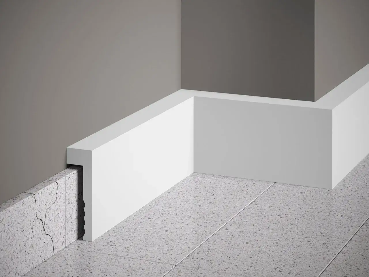 Un coin de mur gris avec une plinthe blanche moderne cachant un mur fissur&eacute;. Plinthe ou pas, le r&eacute;sultat est impeccable.