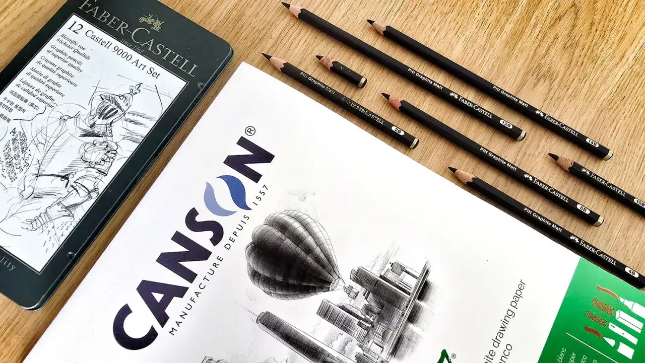 Ensemble de crayons graphite Faber-Castell, un type de crayon pour dessiner, sur du papier Canson.