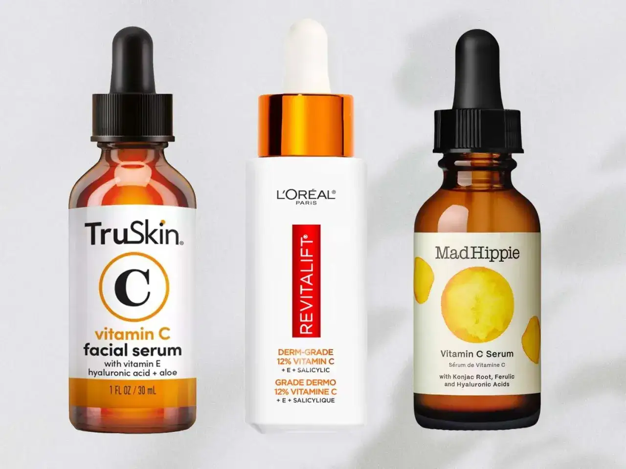 Drei Flaschen Vitamin C Hautpflege-Seren: TruSkin, L'Oréal Revitalift und Mad Hippie.