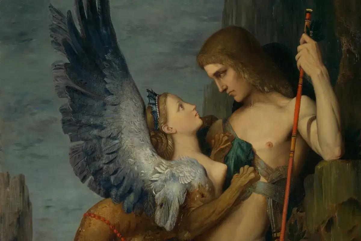 Oedyp i Sfinks, scena z mitologii greckiej. Sfinks z ludzką twarzą i skrzydłami patrzy na młodego mężczyznę.