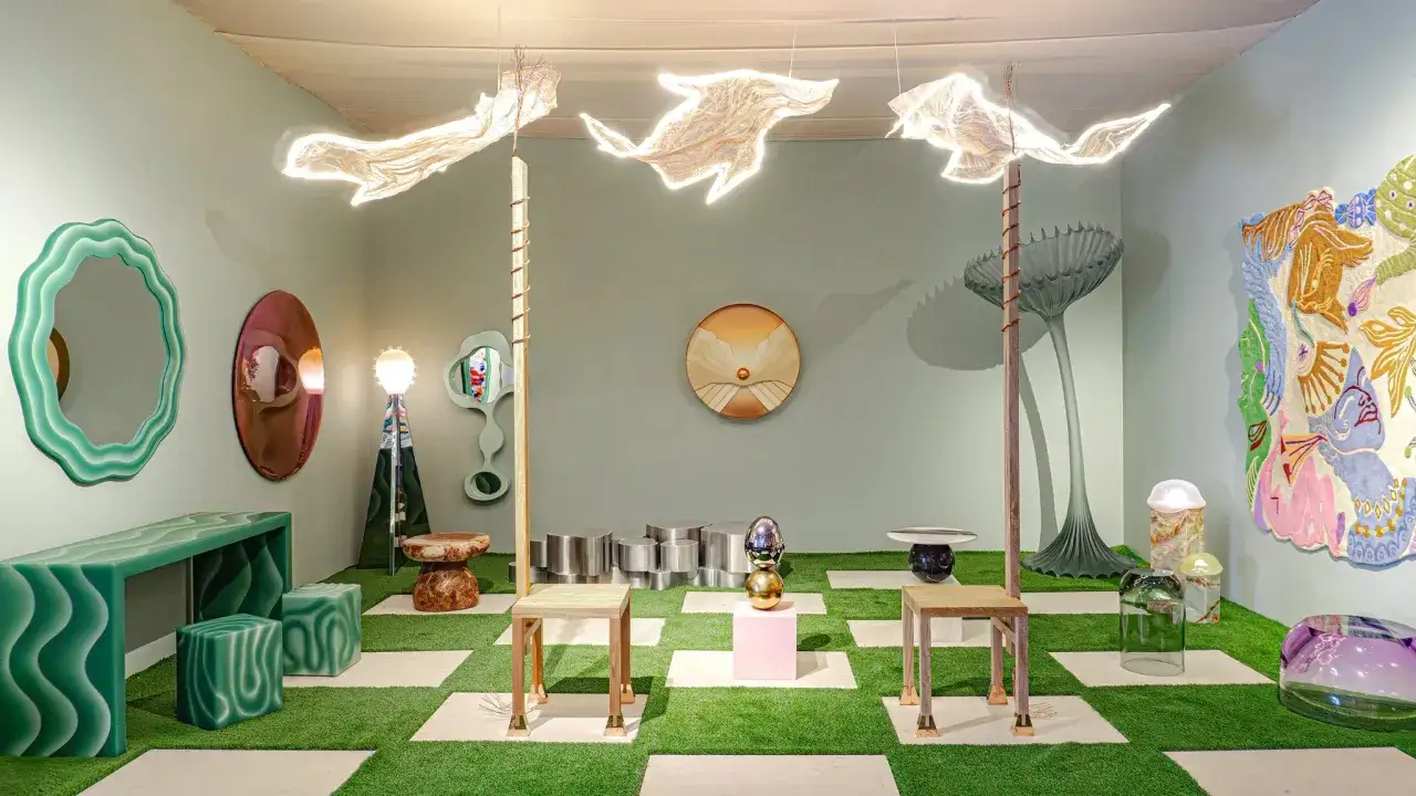 A surreal faena art project room with wavy green furniture, unique mirrors, and whimsical lighting.