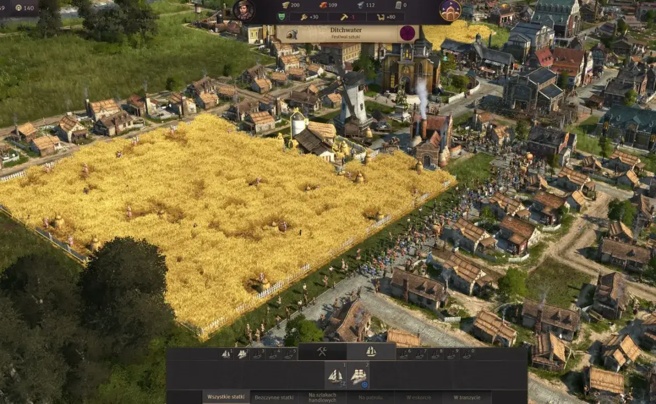 Anno 1800 poradnik: złote pole pszenicy, młyn i miasteczko. Zbiory w pełni, mieszkańcy pracują.