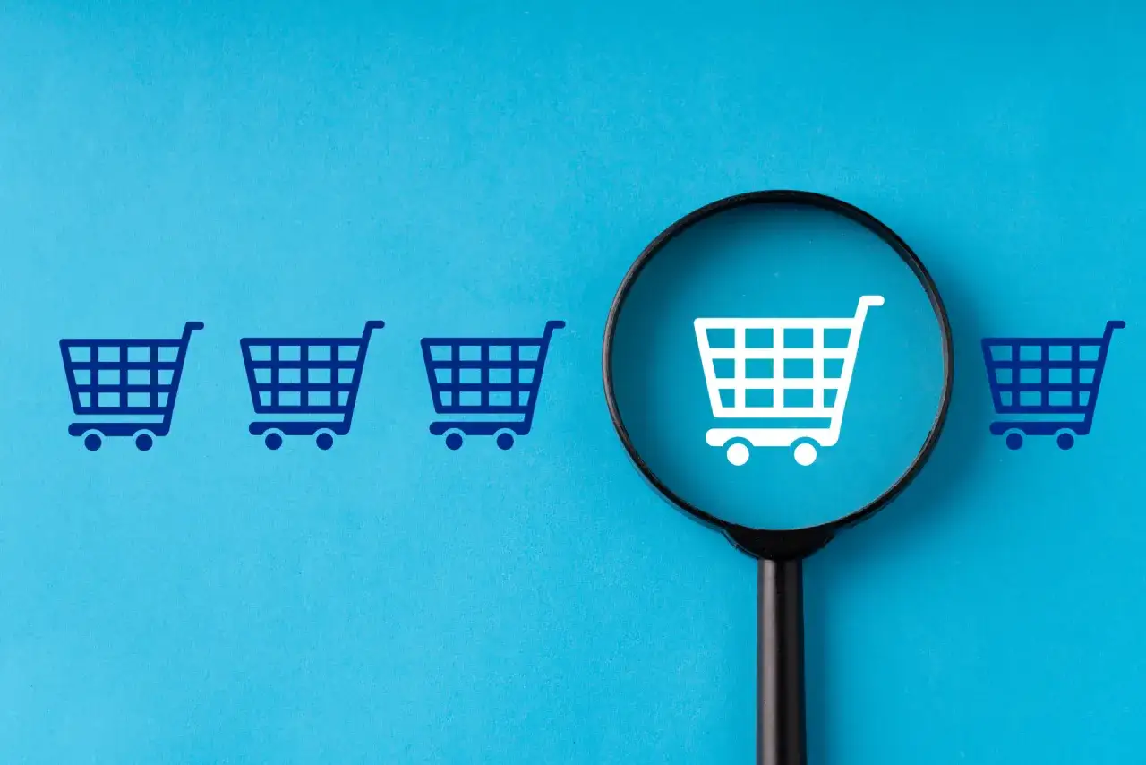 Szukasz odpowiedzi, czy selectshop jest legit? Lupa powiększa biały koszyk, podczas gdy inne są niebieskie.