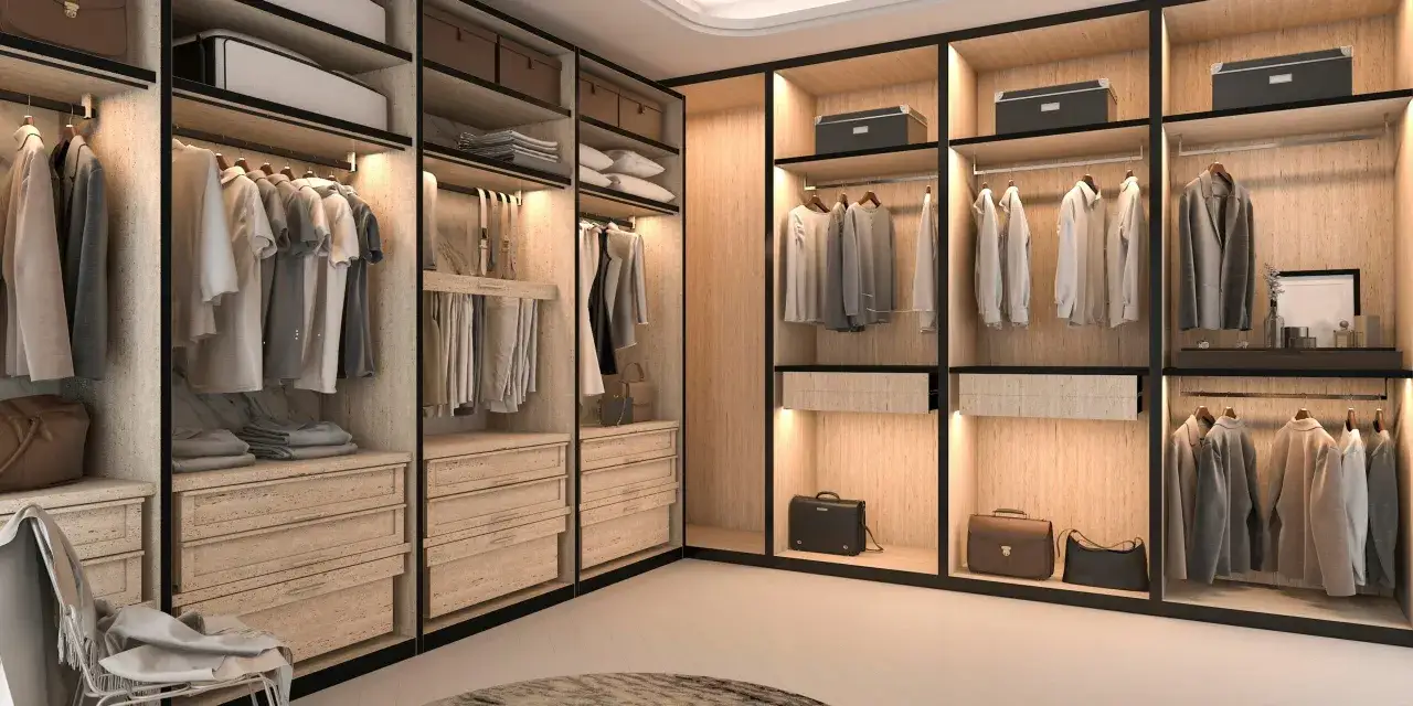 Un armario moderno con cajones, estantes y barras para colgar ropa. Se aprecian diferentes partes de un armario, como perchas con camisas, chaquetas y maletines.