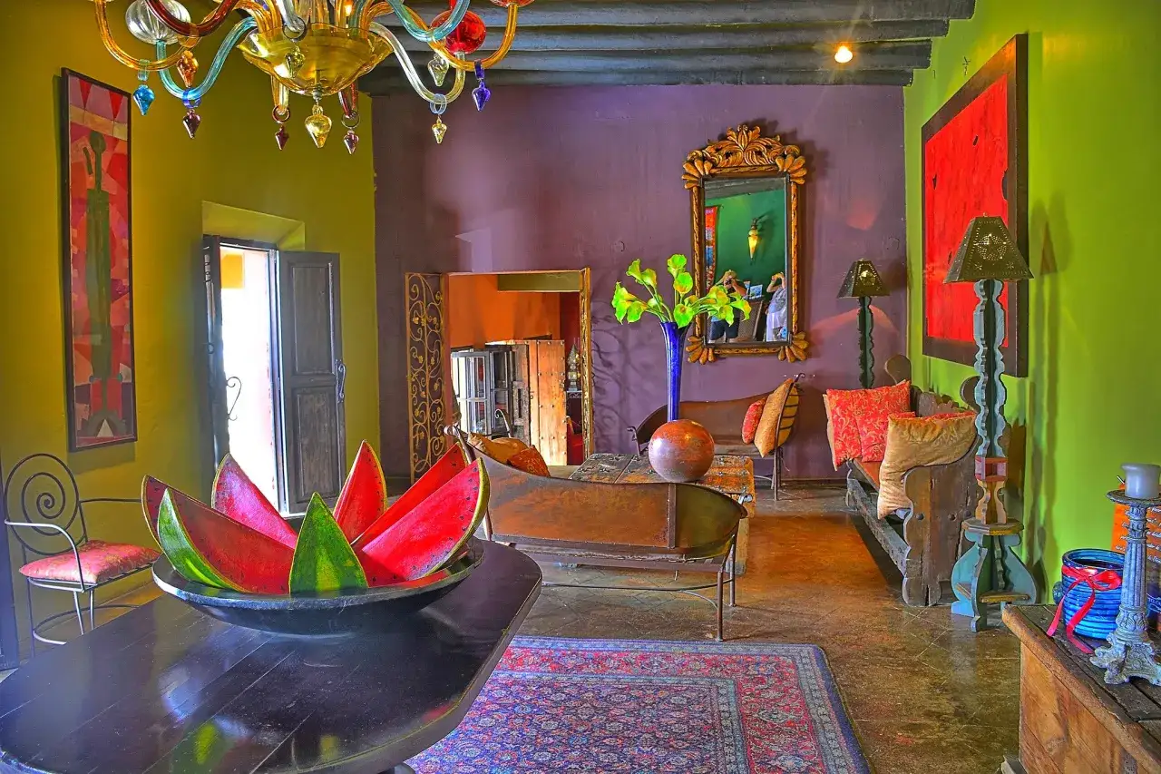Vibrant living room in Mexico City, a colorful display of art and decor, feels chic by accident.