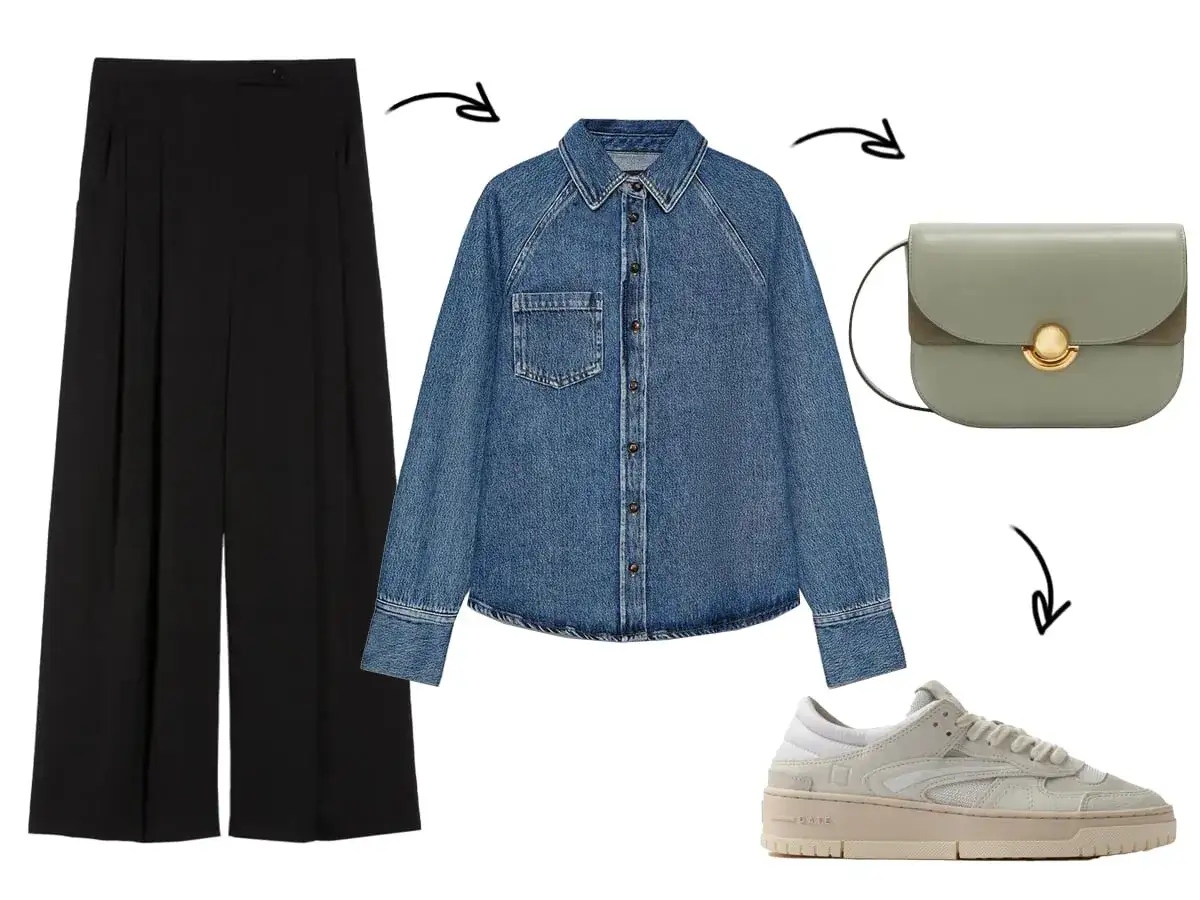 Outfit camicia jeans e pantalone nero: un look casual chic con borsa verde e sneakers beige.