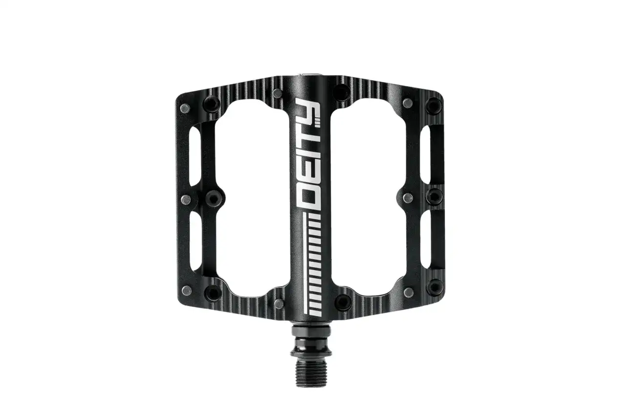 A black Deity Black Kat pedal, ready for a review. Its sleek design and grippy surface promise excellent performance.