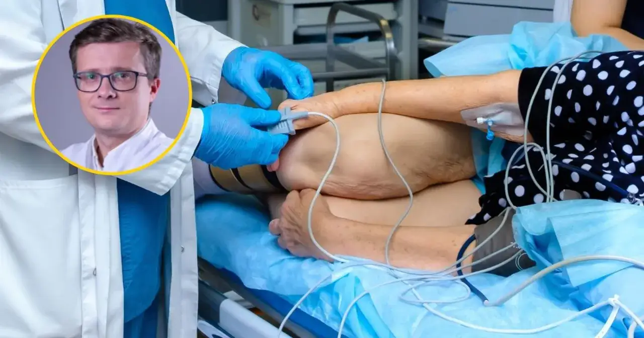 Lekarz w okularach, jeden z najlepszych onkologów od raka jelita grubego, dba o pacjentkę podłączoną do aparatury medycznej.