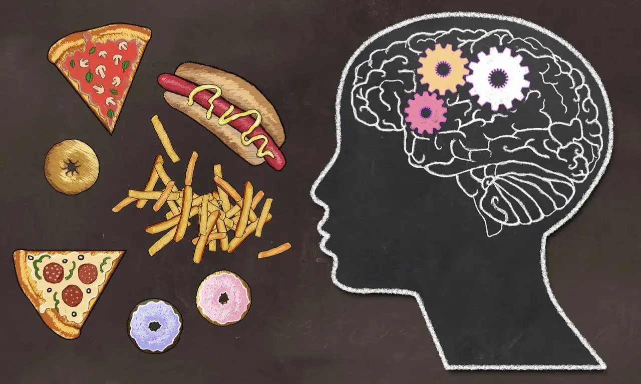 Il cervello con ingranaggi e cibo spazzatura intorno suggerisce il legame tra mangiare in continuazione e malattia.