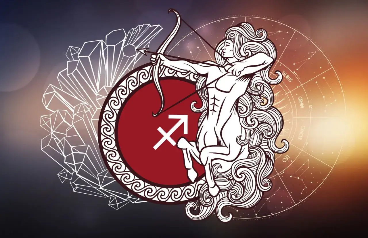 Strzelec, mityczny centaur, celuje z łuku. Obok symbol wagi i kryształy.