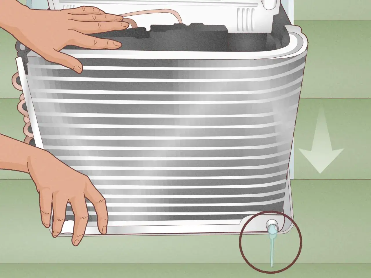 Manos sujetando un aire acondicionado para vaciar el agua. Se ve una gota cayendo de un pequeño tubo.