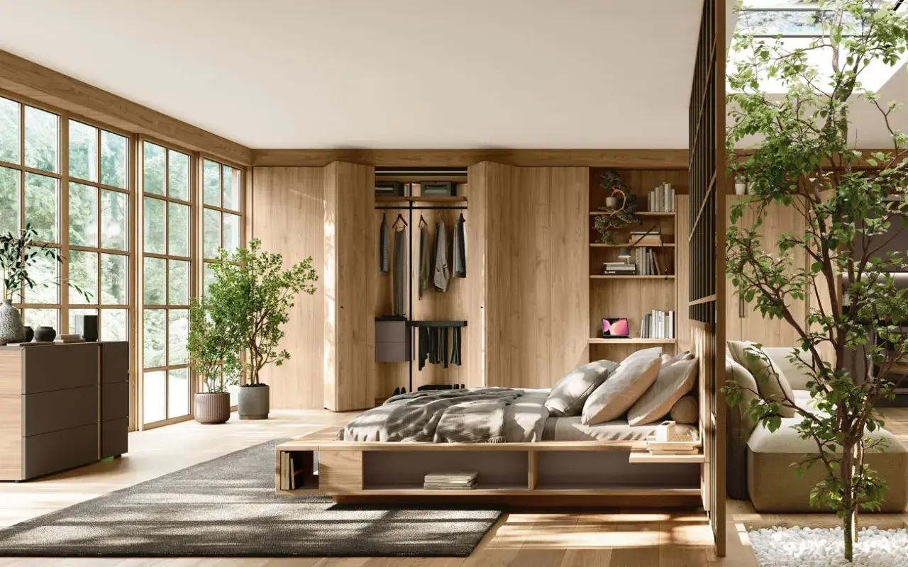 Camera da letto moderna con letto basso in legno, armadio a muro e un piccolo bonsai che porta serenit&agrave;.