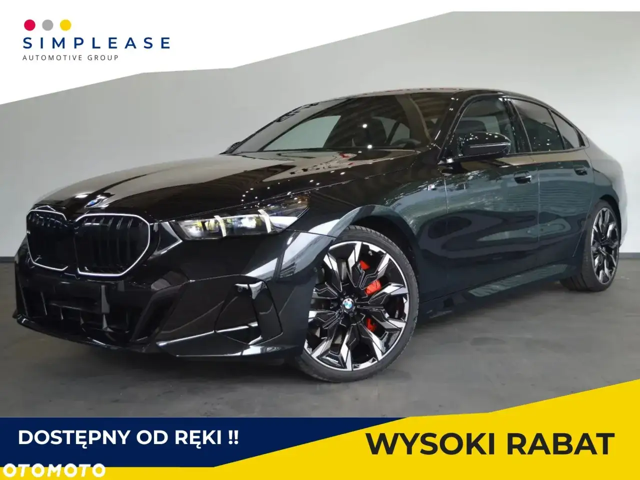 Eleganckie czarne BMW 520d xDrive z czerwonymi zaciskami hamulcowymi, gotowe do odbioru z wysokim rabatem.