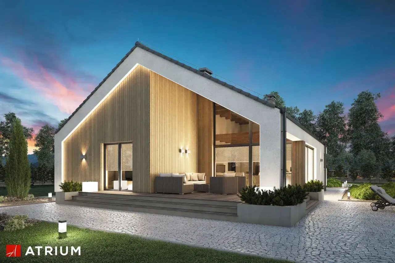Nowoczesne projekty dom&oacute;w z keramzytu: przytulny taras z meblami, duże okna i oświetlenie tworzą ciepłą atmosferę.