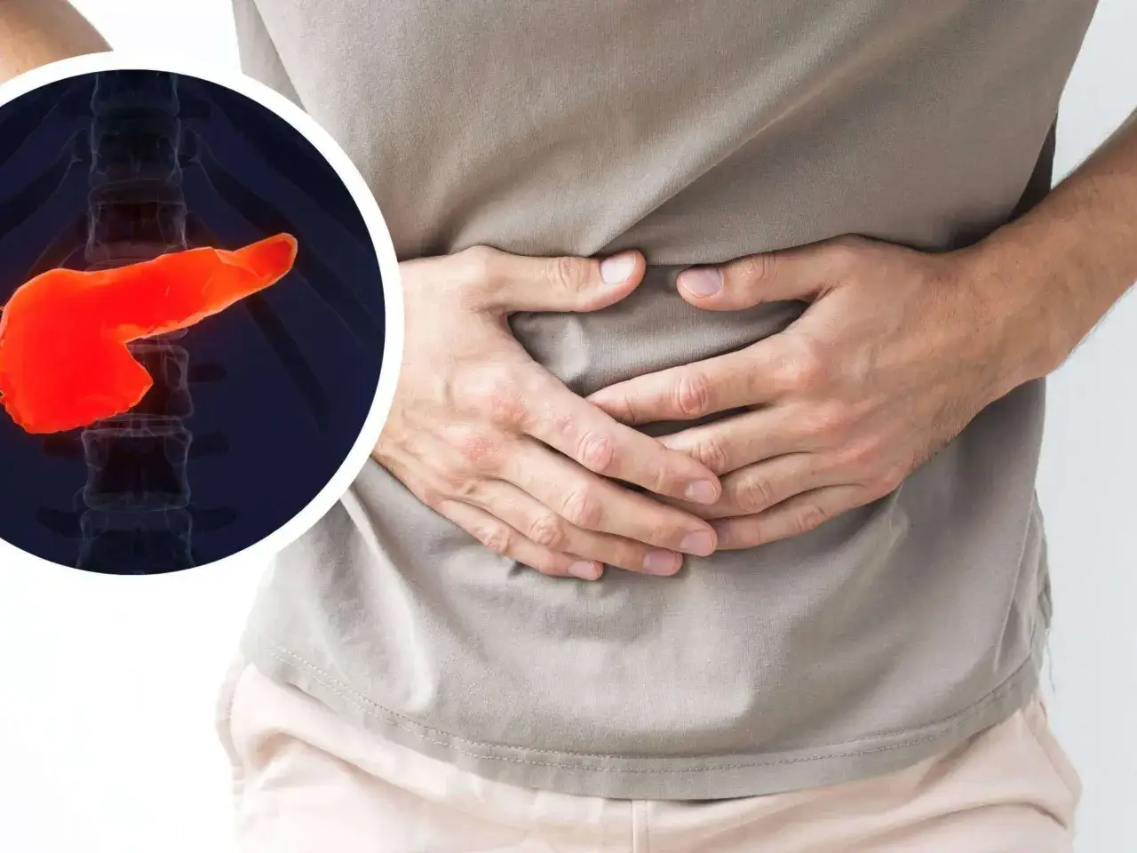 Mann hält sich den Bauch, daneben eine rote Bauchspeicheldrüse. Mögliche bauchspeicheldrüsenentzündung symptome.