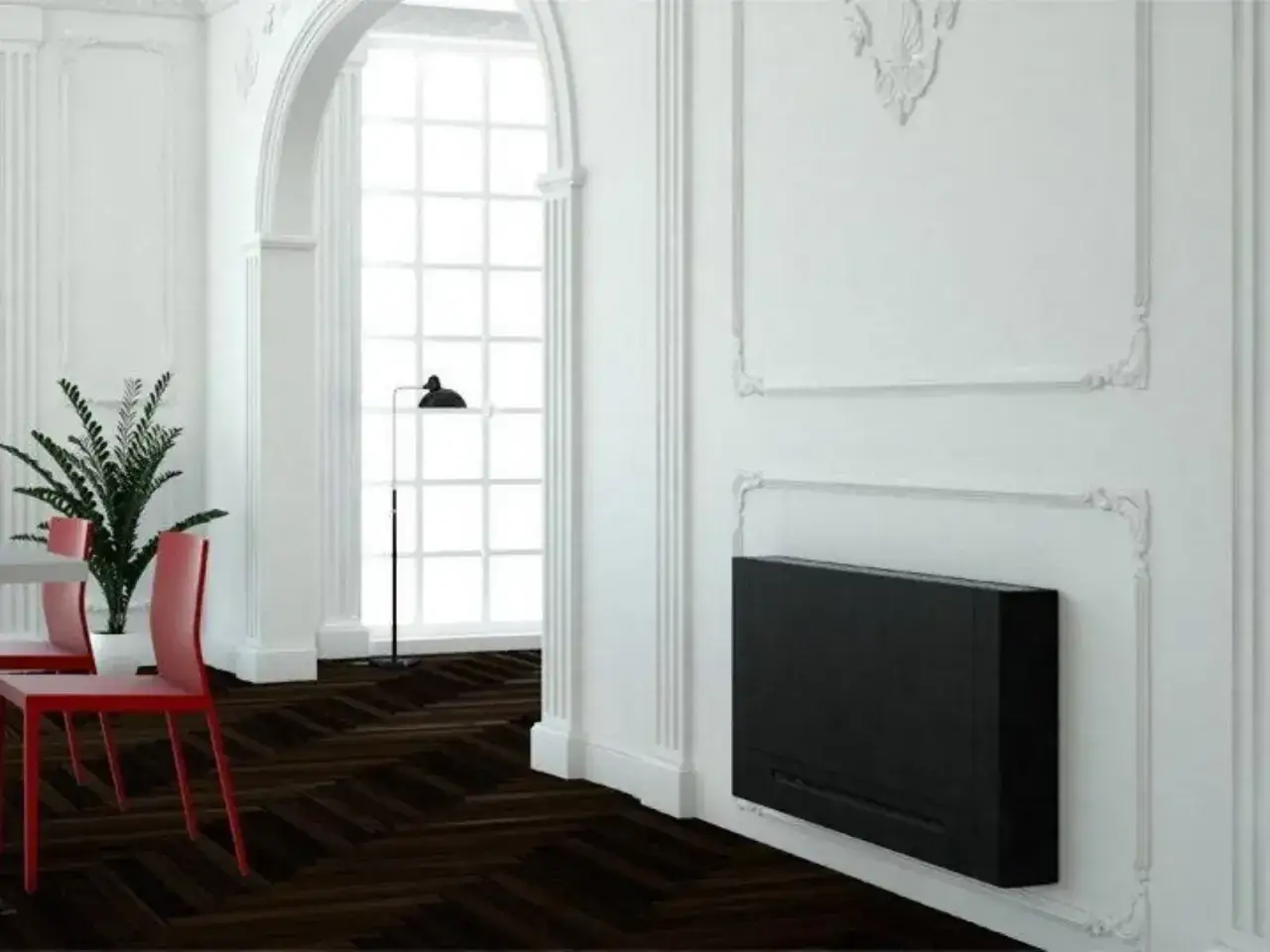 Un elegante termoconvettore ad acqua nero, moderno al posto del classico termosifone, riscalda un ambiente raffinato con parquet scuro e sedie rosse.