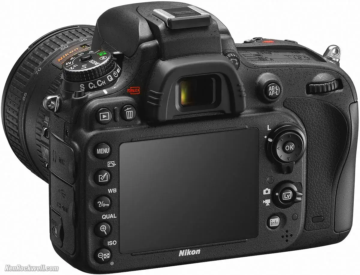 Tył aparatu Nikon D600 z obiektywem, widoczne przyciski sterujące, ekran LCD i pokrętło trybów.