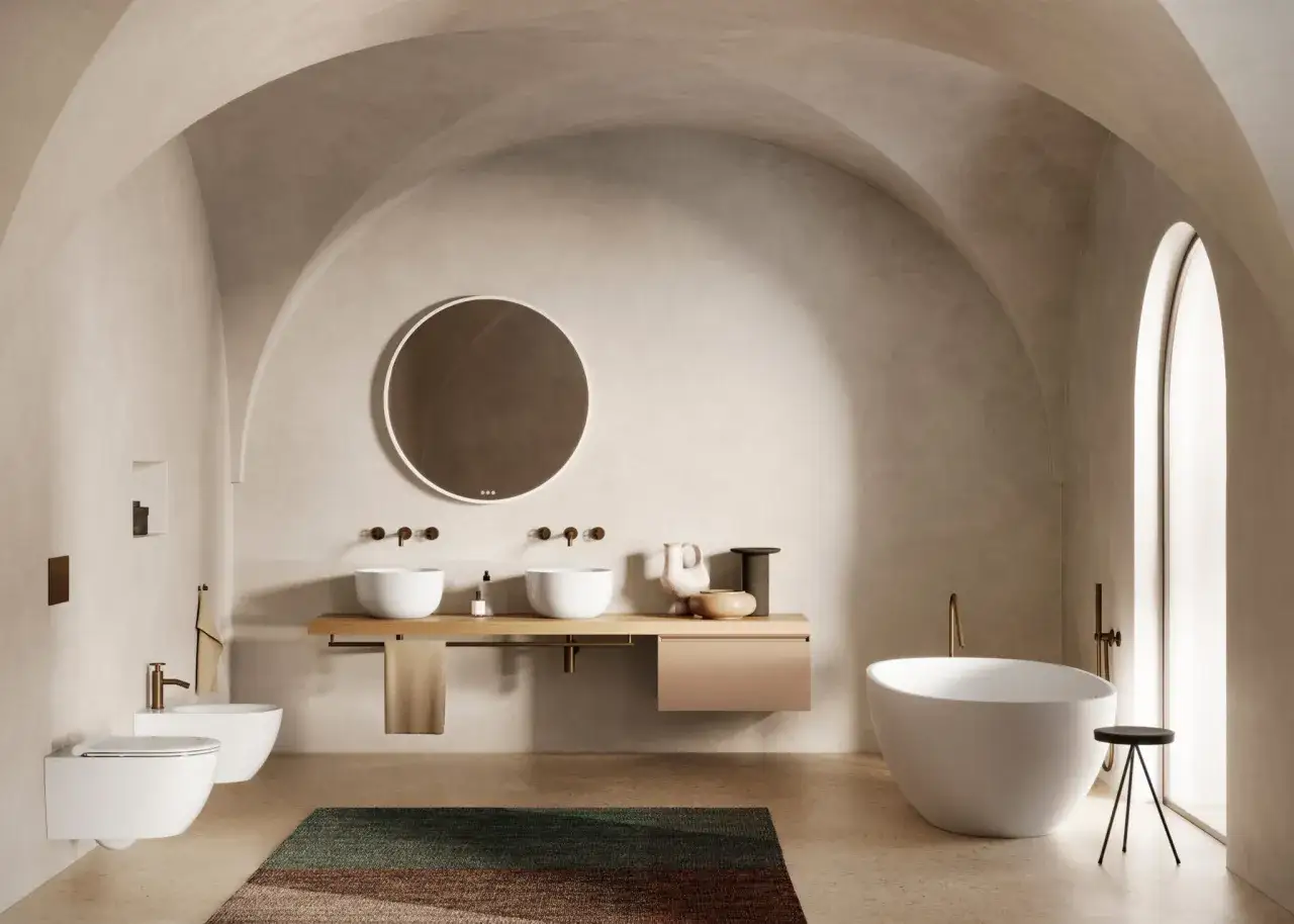 Bagno moderno con vasca freestanding, doppio lavabo e bidet sospeso. L'eleganza dell'artceramica si fonde con un design minimalista e rilassante.