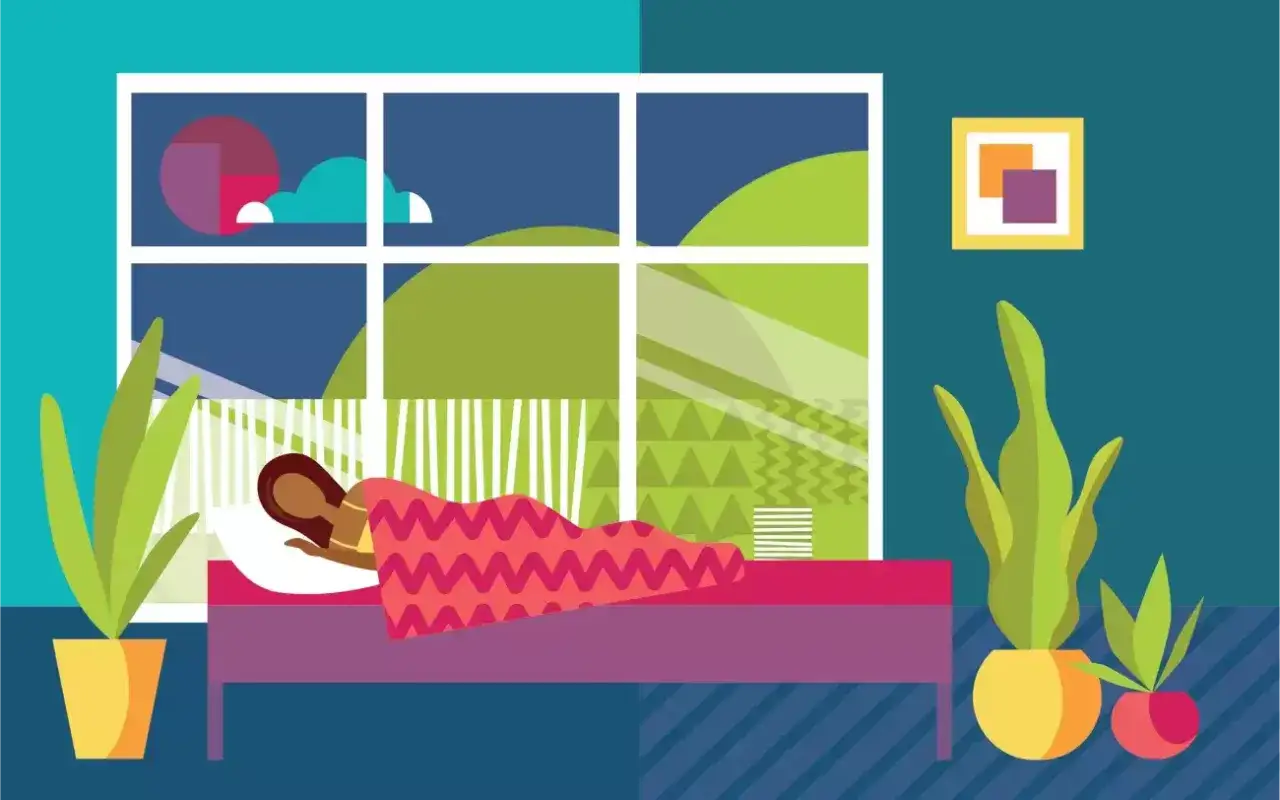Una persona duerme plácidamente en su cama, envuelta en una manta colorida. El ambiente se siente fresco y huele a limpio, con plantas verdes adornando la habitación.