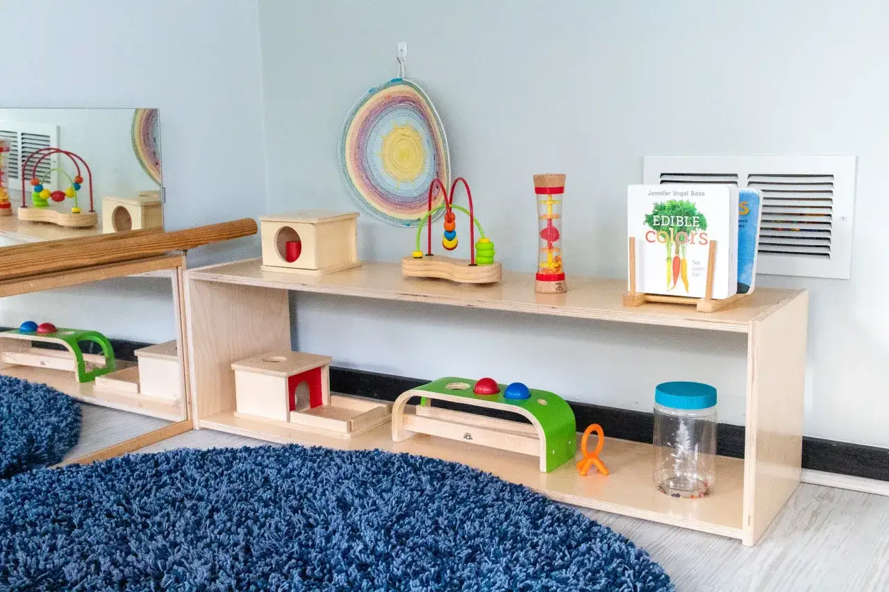 Montessori shelf ideas featuring wooden toys, a bead maze, and books like 