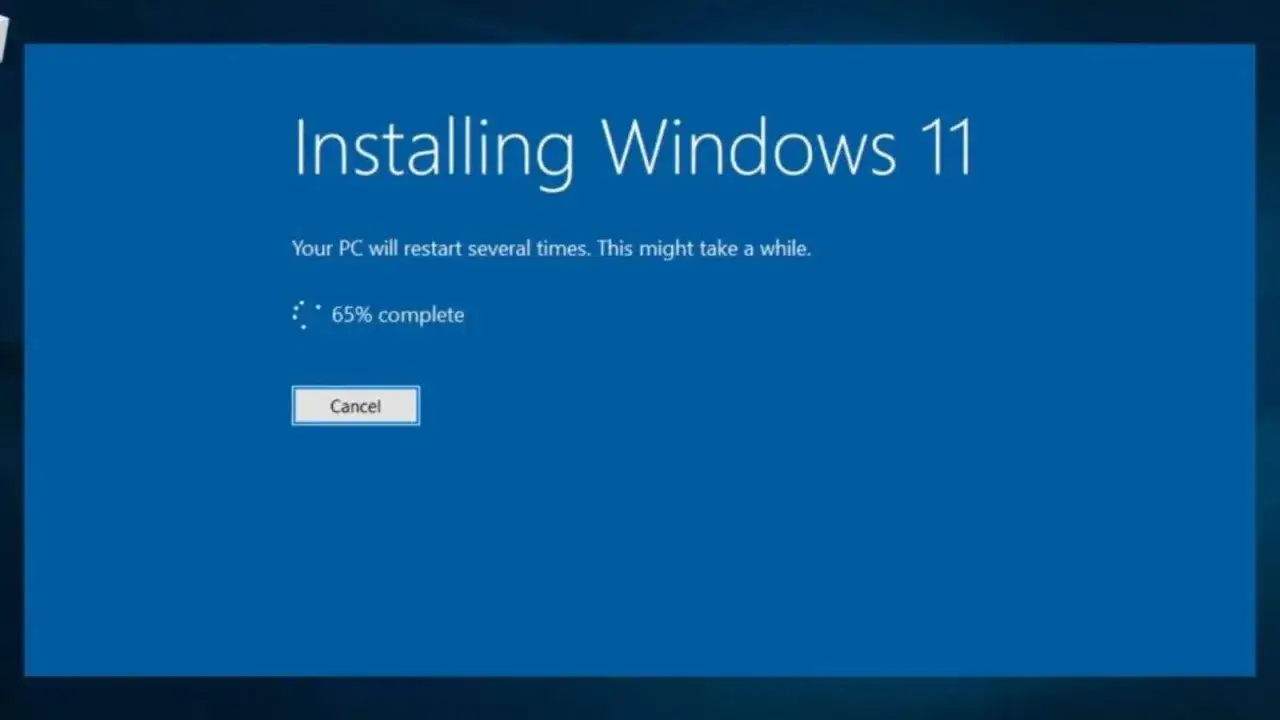 Instalacja Windows 11 trwa, postęp 65%. Komputer zrestartuje się kilkukrotnie.