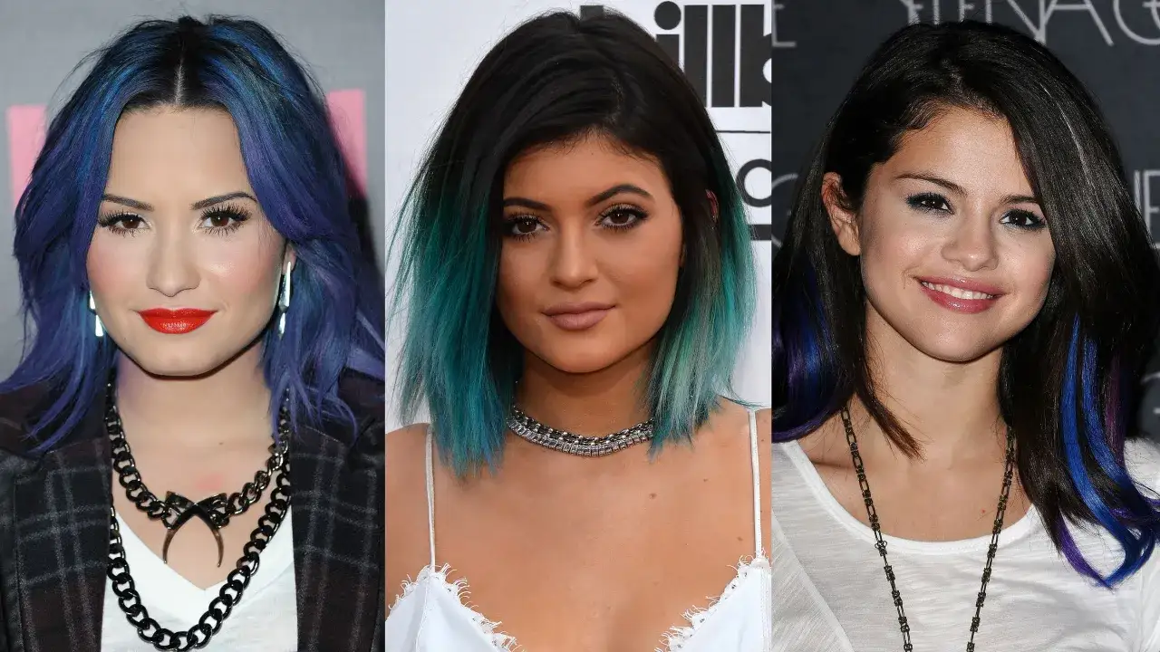 Tres mujeres con cabello teñido: una con azul profundo, otra con verde azulado y la tercera con mechones negro azulado.