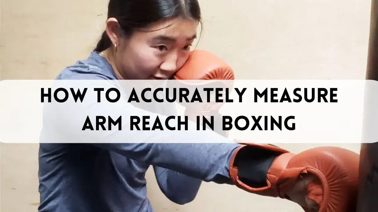 A boxer demonstrates how to accurately measure arm reach in boxing.